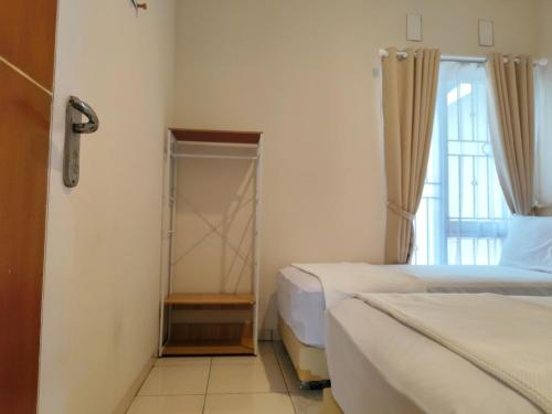 Postel nebo postele na pokoji v ubytování Sleephouse Klayan