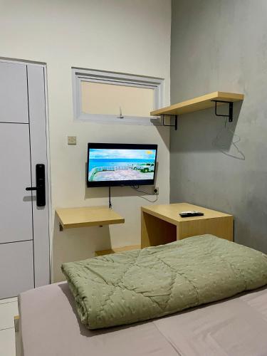 TV a/nebo společenská místnost v ubytování Behomy Cibinong Suite