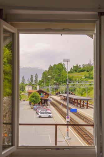 a view of a train station from a window at Hotel Grischuna Filisur in Filisur
