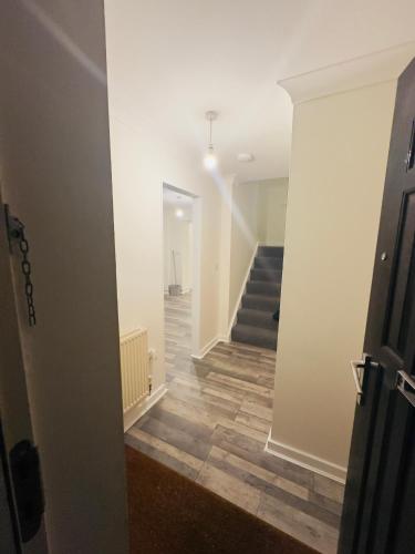 a view of a hallway with a stairway at Comfortable Double Rooms in a Beautiful House in Ipswich
