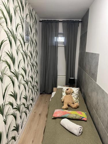 Postel nebo postele na pokoji v ubytování Apartamenty Cieplicka 20