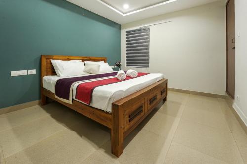 a bedroom with a large bed in a room at Span Avenue in Kozhikode
