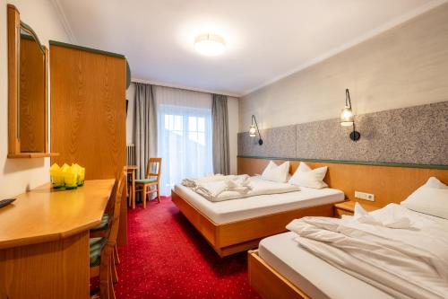 Postel nebo postele na pokoji v ubytování Schnitzl-Eck