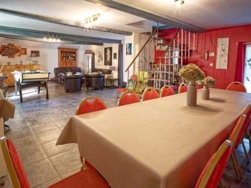 a dining room with a table and chairs at La Fleur de Sel d'Etretat in Bordeaux-Saint-Clair