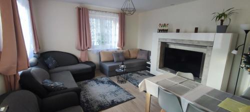 Coin salon dans l'établissement Apartament Słoneczny 11