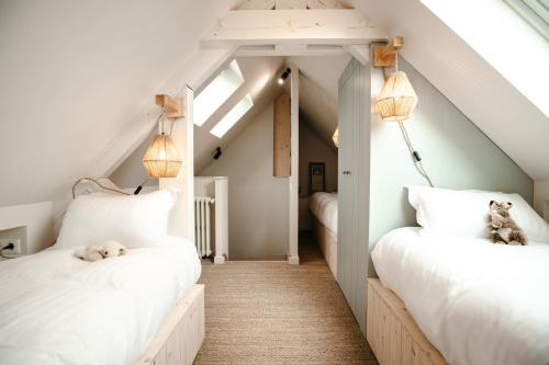 En eller flere senge i et værelse på Gîte de charme vue mer - bord de Rance proche St Malo Dinan