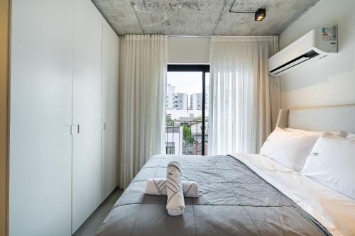 En eller flere senge i et værelse på Studio a 500m da Praia by Achei Camboriú