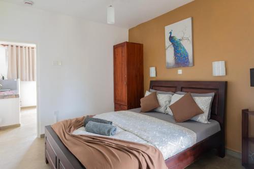 Postel nebo postele na pokoji v ubytování The garden gate resort & Apartments No 01