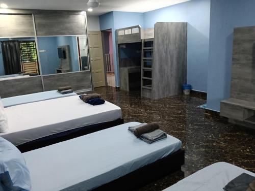 Ein Bett oder Betten in einem Zimmer der Unterkunft JSW PRAMLee Georgetown Penang