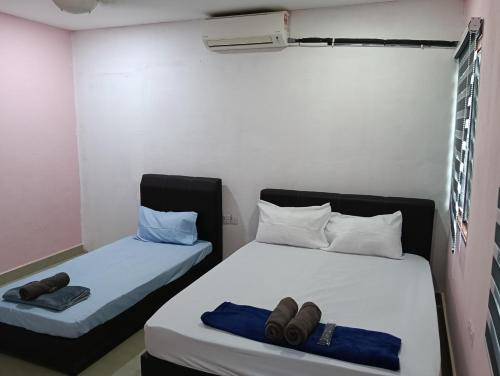 Ein Bett oder Betten in einem Zimmer der Unterkunft JSW PRAMLee Georgetown Penang