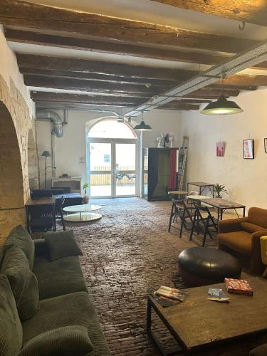 a living room with a couch and a table at Hostel Vertigo Vieux-Port in Marseille