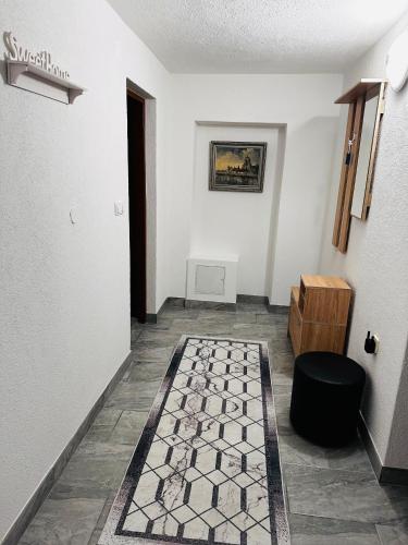 a hallway with a room with a rug on the floor at Apart Cobras Jajce in Jajce