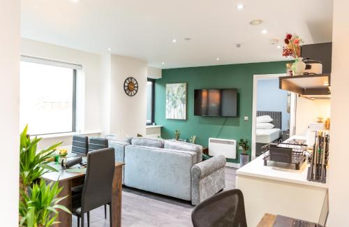 a living room with a couch and a table at Sweet Stay, 2 Bed Luxury Apartment close to Birmingham Central in Birmingham