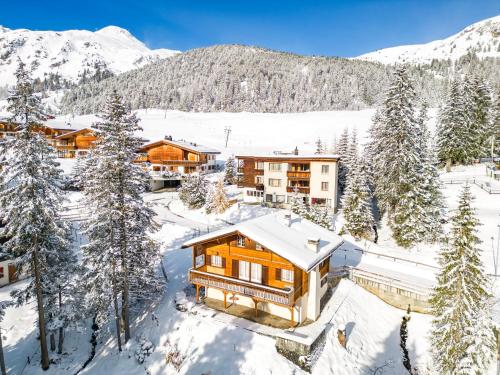 an aerial view of a house in the snow at Chalet Soldanella by Arosa Holiday in Arosa
