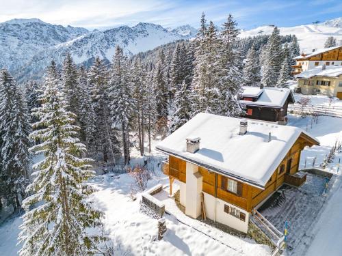 an aerial view of a house in the snow at Chalet Soldanella by Arosa Holiday in Arosa