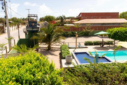 an aerial view of a resort with a swimming pool at Pousada Nascer da Lua in Fortim
