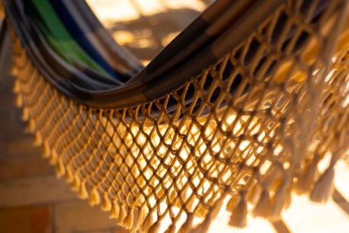 a close up of a wicker bench at Pousada Nascer da Lua in Fortim