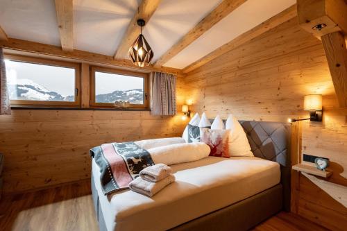 Ένα ή περισσότερα κρεβάτια σε δωμάτιο στο Lodge Kitzbüheler Alpen