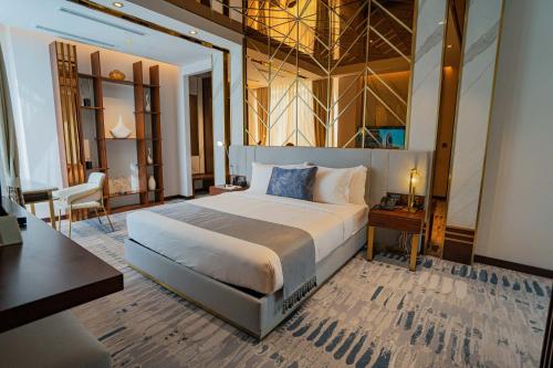 a large bedroom with a large bed in a room at Velero Hotel Doha Lusail in Doha