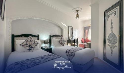 Postel nebo postele na pokoji v ubytování Hotel Parador