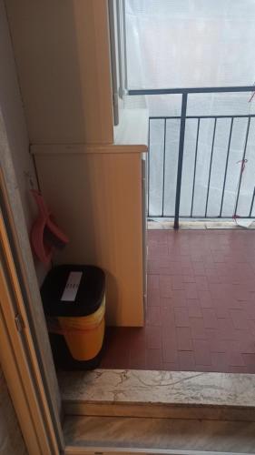 a room with a stairs with a ottoman next to a window at Casa Stella Terminal in Perosa Argentina