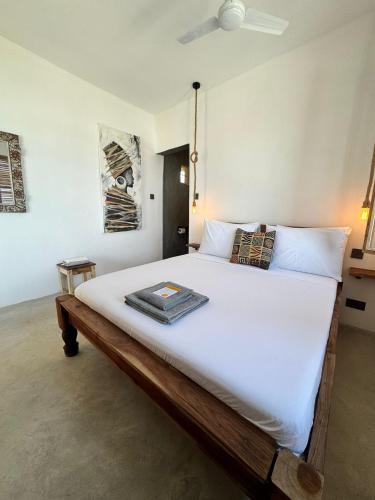 Postel nebo postele na pokoji v ubytování Mango Beach House