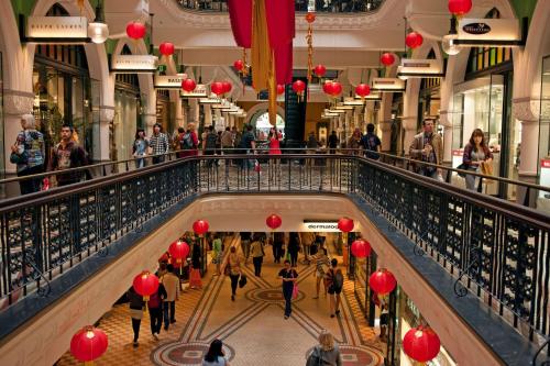 people walking in a shopping mall with red lanterns at Metro Apartments on King in Sydney