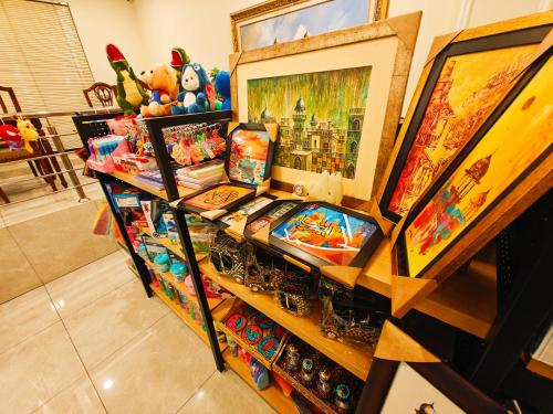a shelf with a train and other items on it at Hayyat Luxury Hotel Apartments in Lahore