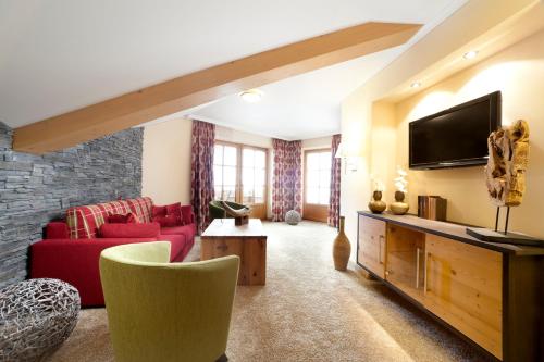 TV a/nebo společenská místnost v ubytování Hotel Sommer-Haus am See