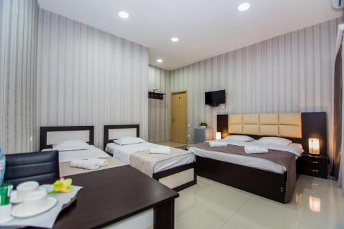 Postel nebo postele na pokoji v ubytování Hotel Care Inn