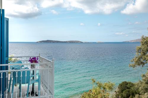 a view of the ocean from a balcony at Aneroussa Beach Hotel in Batsi
