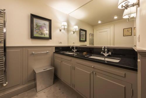 a bathroom with a sink and a toilet at Rinascimento Privato by MMega in Florence