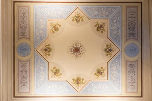 a ceiling in a building with blue and white ceilings at Rinascimento Privato by MMega in Florence