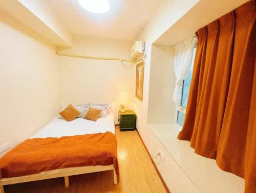 Postel nebo postele na pokoji v ubytování Rolla Cottage南岸亚太商谷