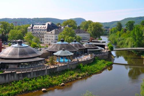 an overhead view of a river with buildings and a bridge at Ferienhaus Auszeit in Bad Kreuznach