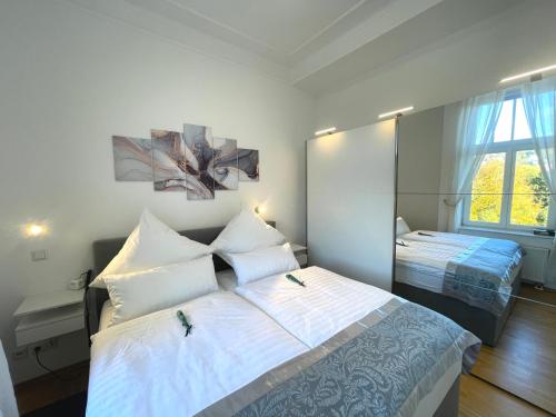 Кровать или кровати в номере Ferienwohnung im Grand Living