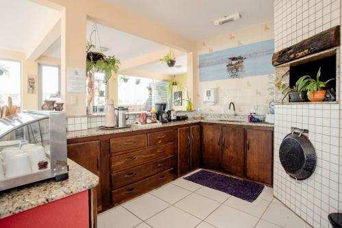 Dapur atau dapur kecil di Suítes Balneário Camboriú