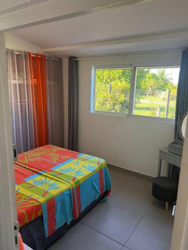 Postel nebo postele na pokoji v ubytování BAIE dES CARAIBES