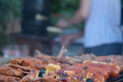 a bunch of sausages and other food on a grill at Hotel Kalenborner Höhe in Kalenborn