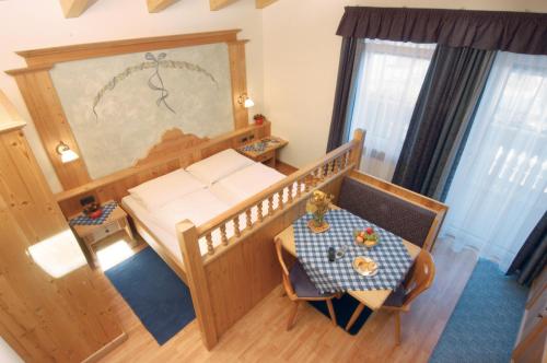 Postel nebo postele na pokoji v ubytování Residence Priska