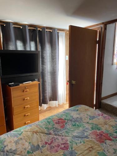 En eller flere senge i et værelse på Bahiano