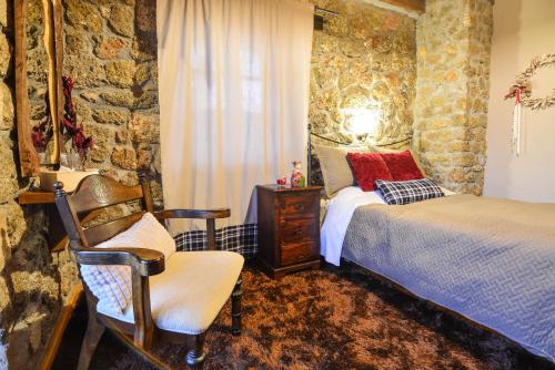 A bed or beds in a room at Petrino Lodge