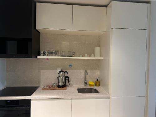 Cuisine ou kitchenette dans l'établissement Take Me Home