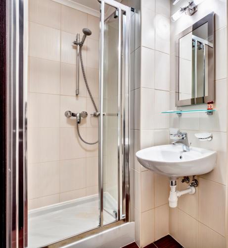 a bathroom with a shower and a sink at Bratislava Hotel Kyiv in Kyiv