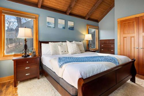 a bedroom with a large bed and a window at Bear Necessities with Wintergreen Advantage in Wintergreen