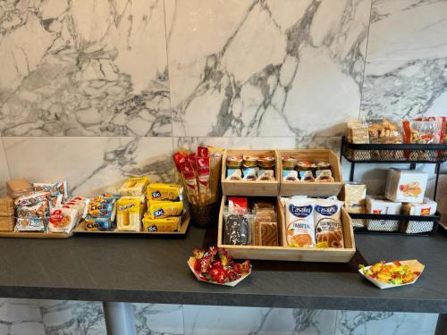 a table with three trays of food on it at Cristina's House in Ferrara