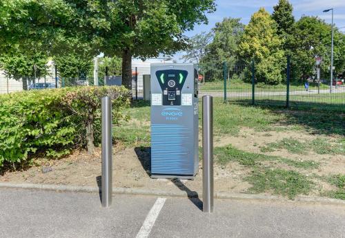 a parking meter in a parking lot in a park at B&B HOTEL Beaune Sud 1 Palais des Congrès in Beaune