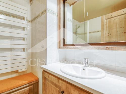 a bathroom with a sink and a mirror at Appartement duplex lumineux, 4 pièces, 6 pers, Méribel centre, pistes et commerces à proximité - FR-1-411-736 in Les Allues