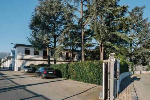a house with cars parked on the side of a street at Albereto 41 in Calenzano