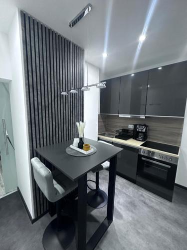 Kuchyň nebo kuchyňský kout v ubytování Apartment SaGo
